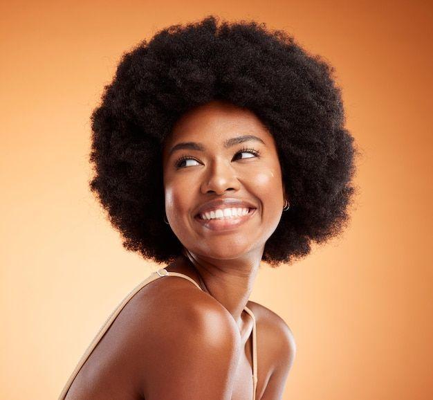Premium photo black woman african beauty and skincare health of luxury spa model with a smile on an orange studio background natural skin healthy face and happy casual organic cosm